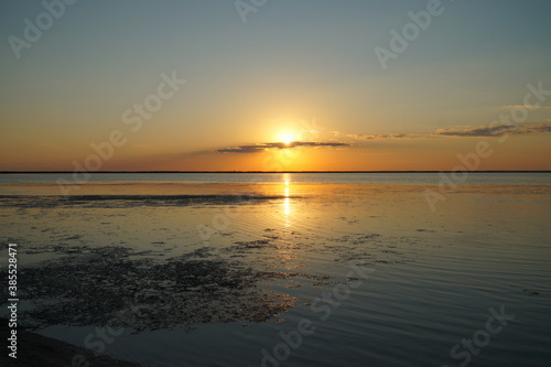A sunny path from the setting sun on the calm water of the estuary.    © ReitNN