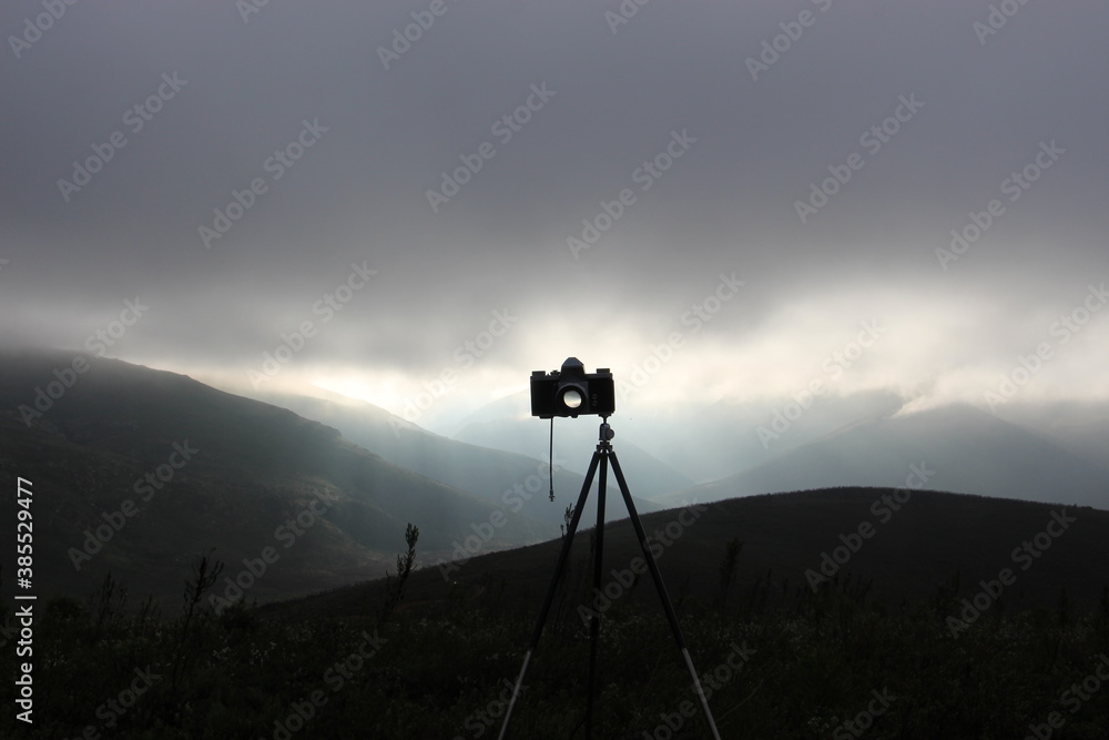 vintage camera on mountain at sunrise