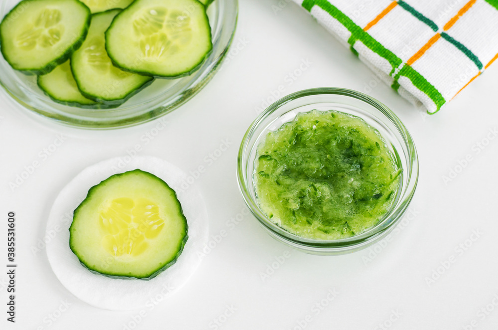 Small glass bowl with cucumber puree. Homemade face or eye mask, natural beauty treatment and spa recipe. Small glass bowl with cucumber puree. Homemade face or eye mask, natural beauty treatment and spa recipe.