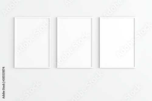 Empty photo frame hanging for mockup in empty white room. 3D rendering.