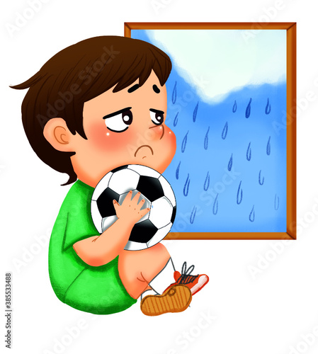 Sad upset little boy sits nar window while raining