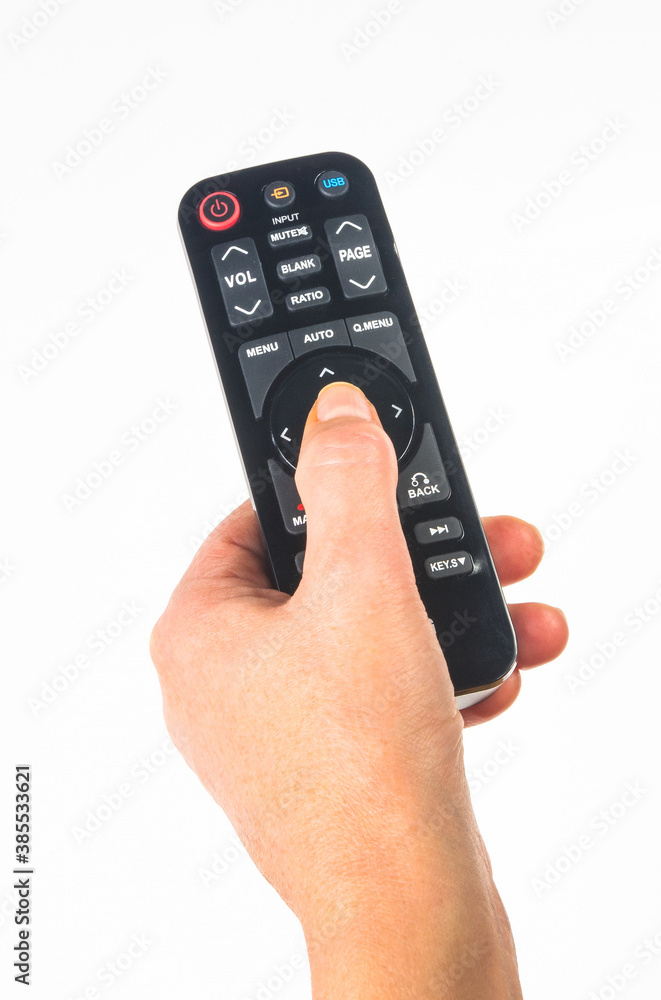 hand holding a remote control on white background, close-up hand holding a remote control on white background, close-up
