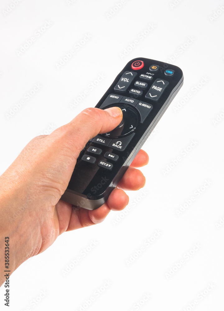 hand holding a remote control on white background, close-up hand holding a remote control on white background, close-up
