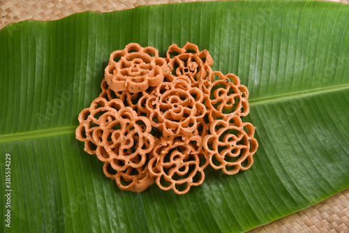 Rose Cookies or Achu Murruku Achappam  achapum, banana leaf rosette cookie Anglo Indian cookie Indian Christians christmas, rice flour,   Kerala South India Traditional Malaysian, Indonesian Brunei  photo