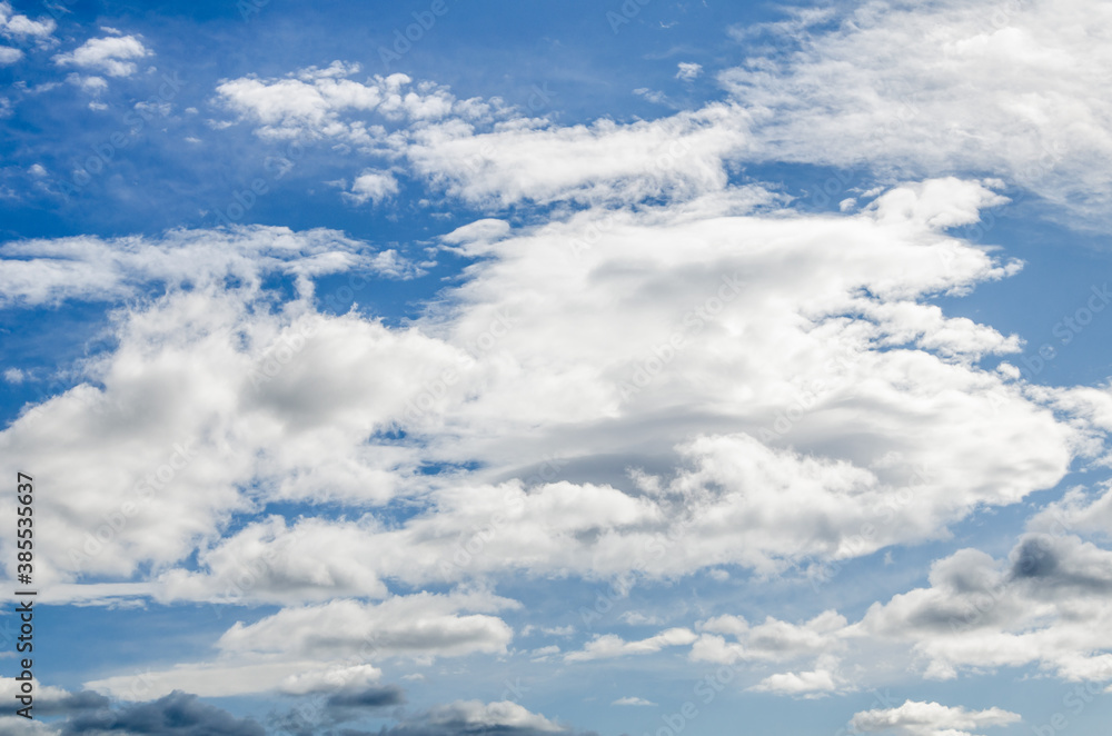 White clouds in a bright blue sky. The beauty of the nature White clouds in a bright blue sky. The beauty of the nature