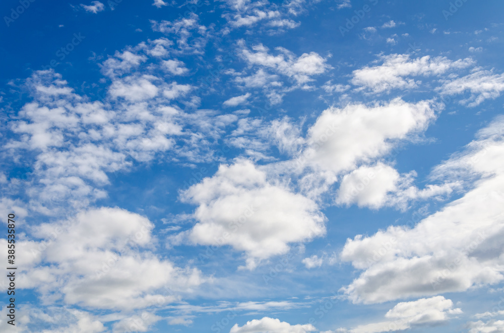 White clouds in a bright blue sky. The beauty of the nature