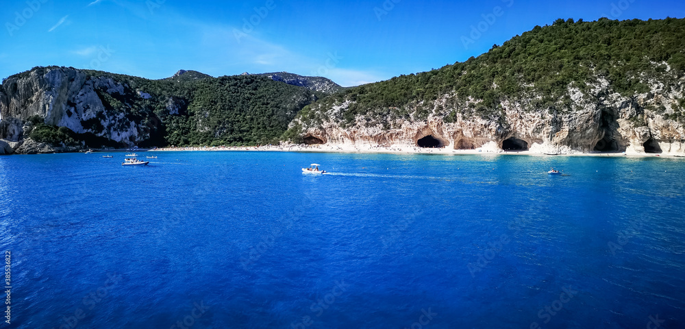 ultra wide panorama of the beach and the coast line of Cala Luna