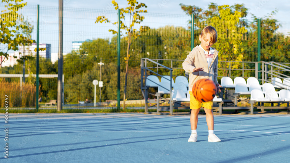 Little boy playing basketball on the court Stock Photo Adobe Stock