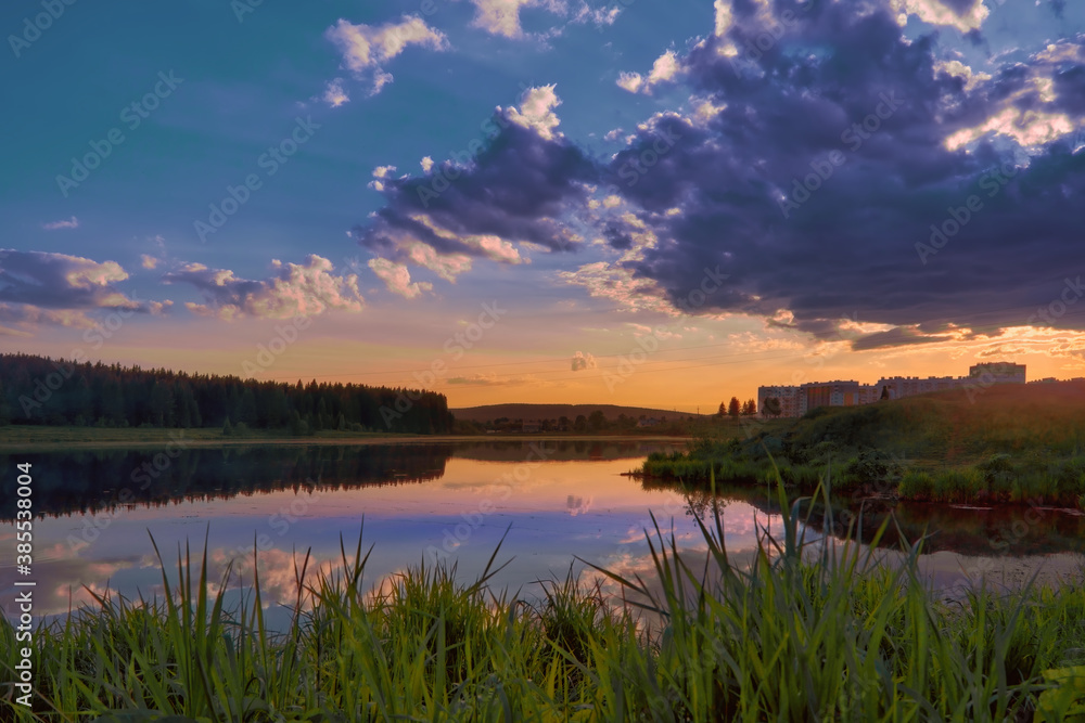 Picturesque summer landscape with riverbank at sunset. Wonderful nature, beautiful natural background.