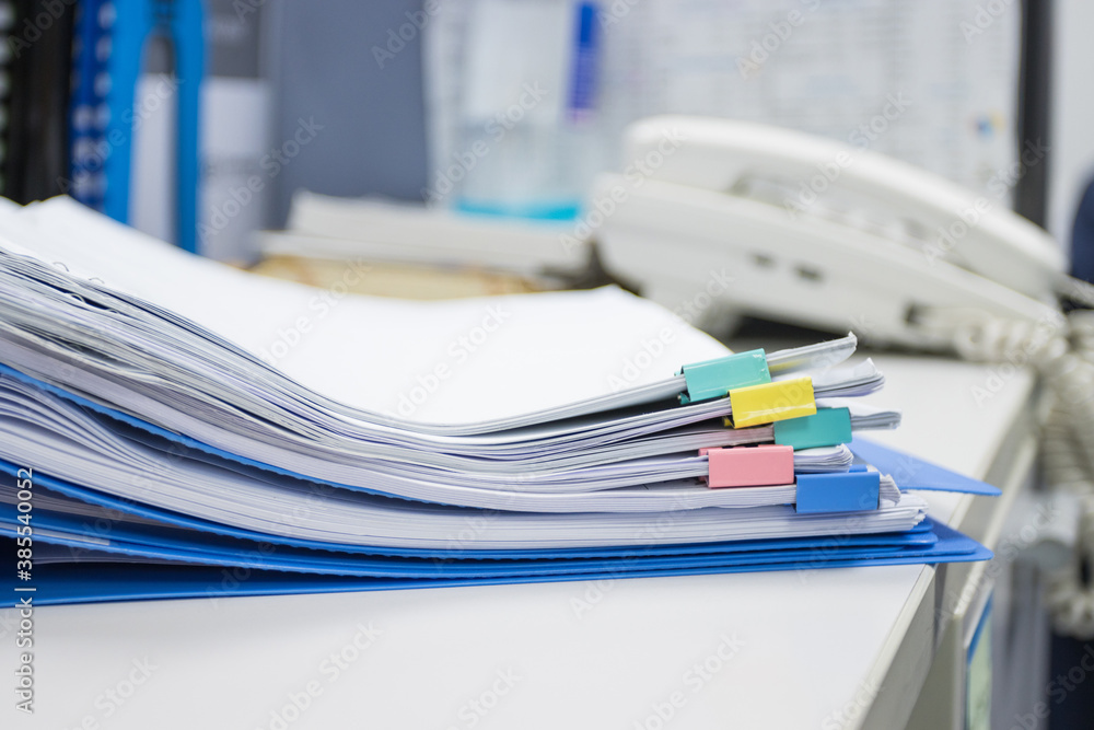 file folder and Stack of business report paper file in a work office, concept document in work office file folder and Stack of business report paper file in a work office, concept document in work office