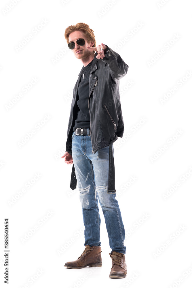Stylish handsome cool macho rocker man showing heavy metal horns hand sign. Full body isolated on white background. Stylish handsome cool macho rocker man showing heavy metal horns hand sign. Full body isolated on white background.
