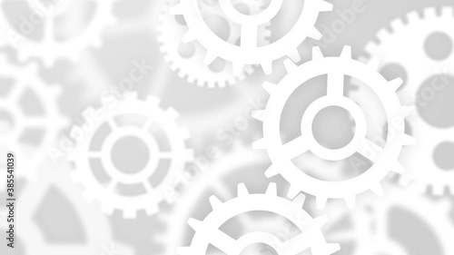 Abstract computing technology concept for business, finance and industry with gears. White cogwheels on gray blurred bokeh background.