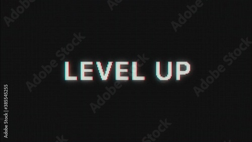 Level Up text message appear on old display. Pixeled text animated on retro monitor with chromatic abberations. 4k 60 fps