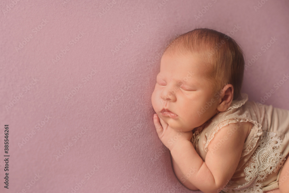 Newborn baby girl on pink blanket Newborn baby girl on pink blanket