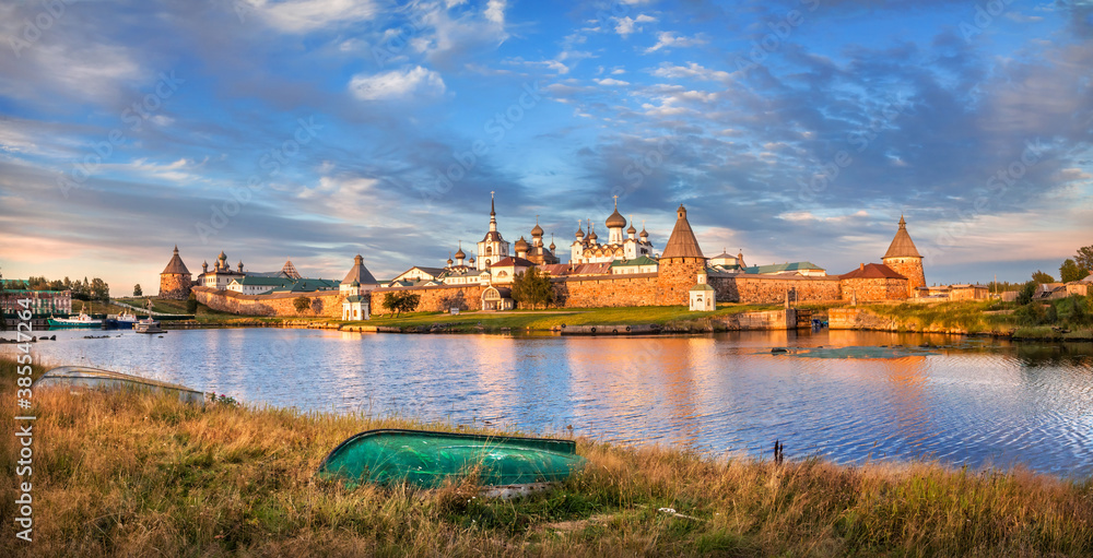 Naklejka premium Solovetsky Monastery on the Solovetsky Islands and an overturned boat