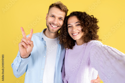 Two mixed race people on yellow background