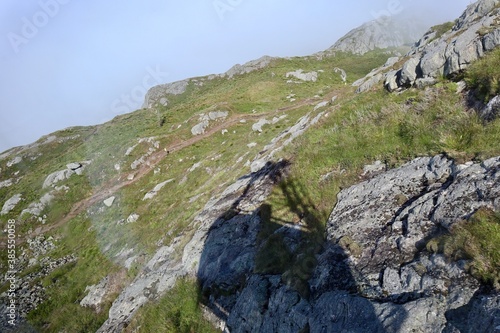 mountain landscape with gondola shadow