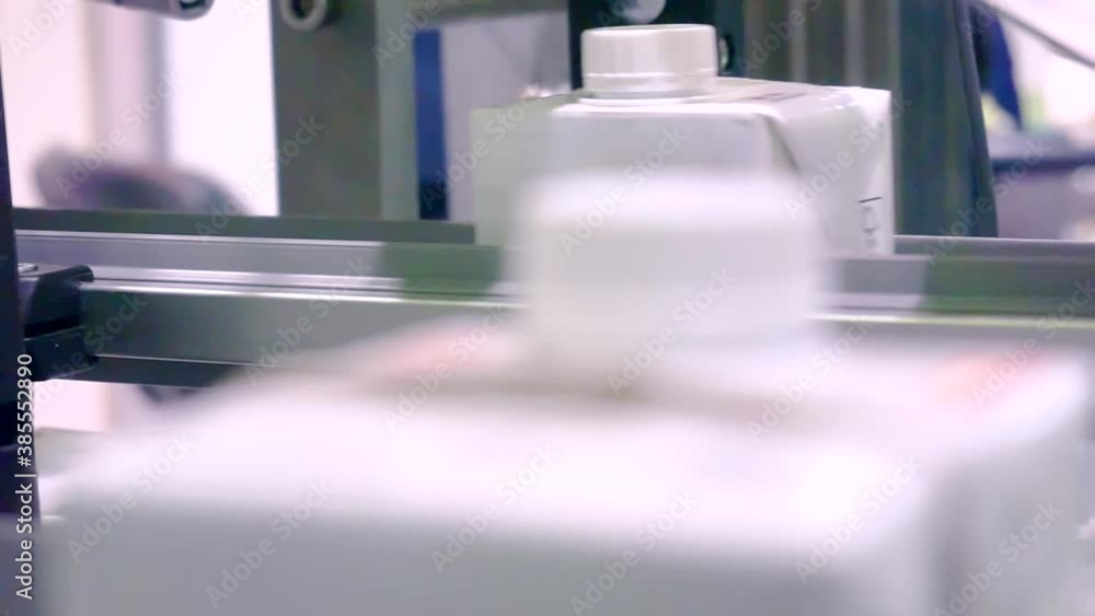 packing line. drinks packed in plastic containers move along a conveyor belt packing line. drinks packed in plastic containers move along a conveyor belt
