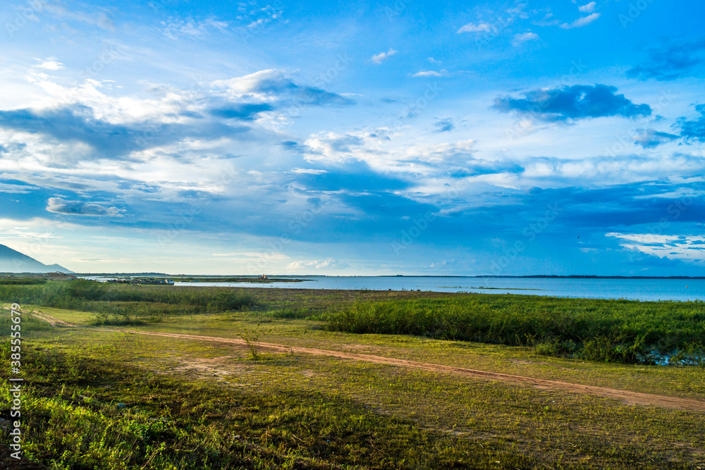 View of beautiful sunset with blue sky in Dau Tieng lake, Tay Ninh province, Vietnam. View of beautiful sunset with blue sky in Dau Tieng lake, Tay Ninh province, Vietnam.