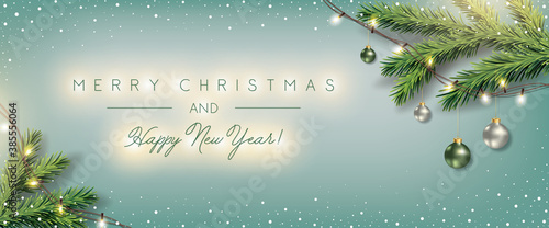 Christmas Blue Background with Xmas Balls, Fir, Christmas Lights decoration and Elegant Greeting Text of Winter Holidays	