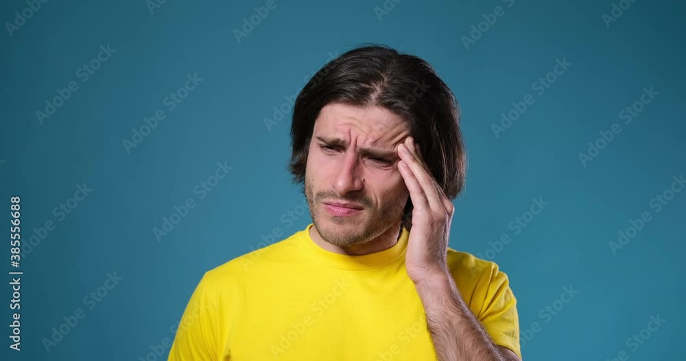 Young man suffering from extreme head and neck pain Young man suffering from extreme head and neck pain