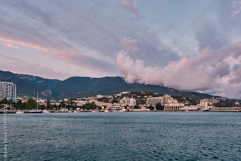 Beautiful cityscape at sunset. Evening resort Yalta, Crimea.