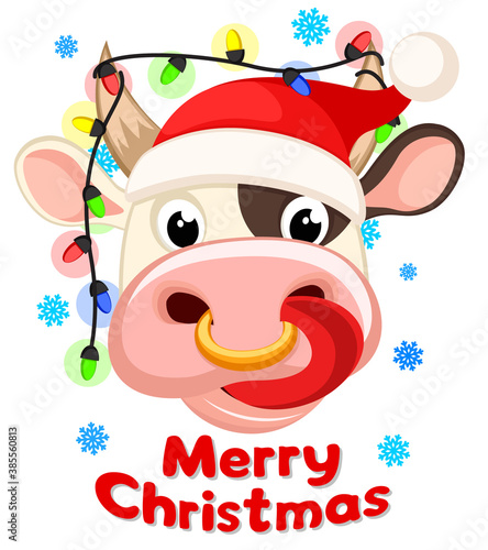 The head of a bull with a protruding tongue and a New Year s garland between the horns. Happy new year 2021. Bull christmas
