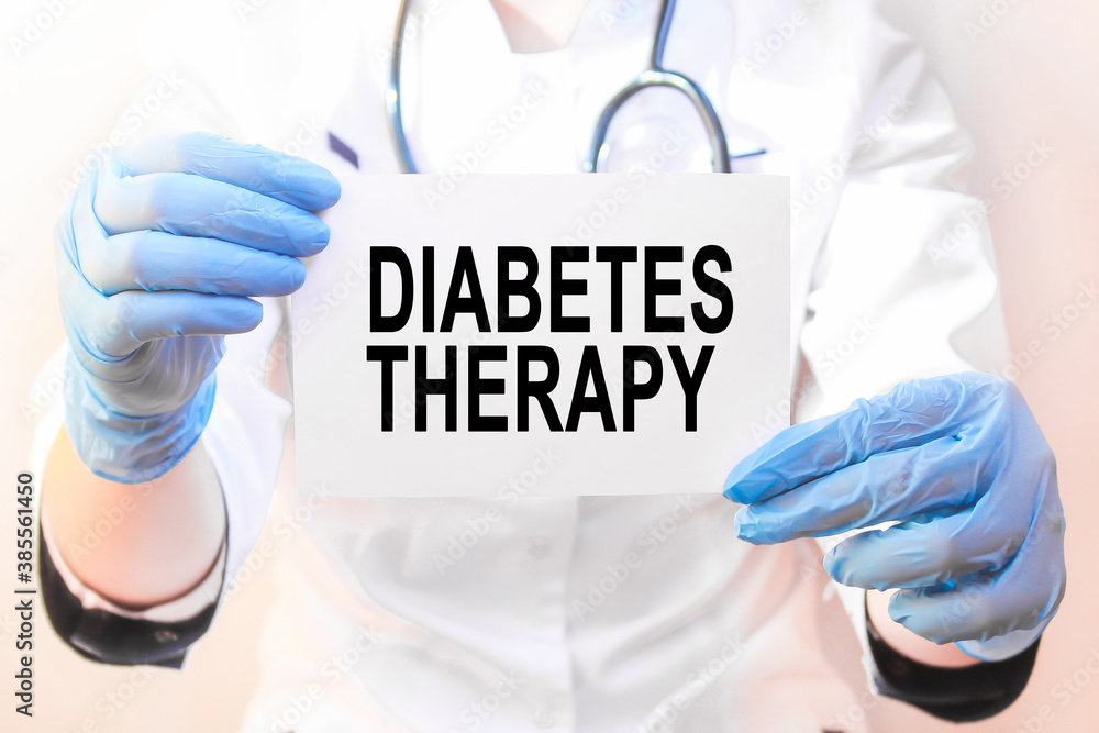 Doctor holding a card with text DIABETES THERAPY, medical concept Doctor holding a card with text DIABETES THERAPY, medical concept