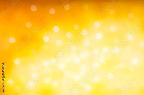 Christmas and New Year holidays blurred orange sparkles background, abstract background with bokeh defocused glittering lights and shadow
