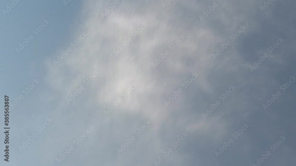 A water spray from a high pressure water gun against a clear blue sky. A water spray from a high pressure water gun against a clear blue sky.