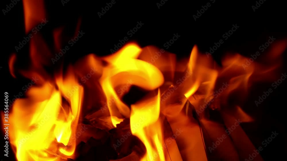 Burning and glowing paper - Isolated on black background Burning and glowing paper - Isolated on black background