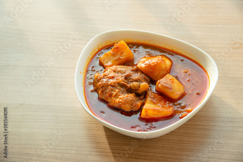 Thai Chicken massaman curry - Thai chicken and potato curry in coconut milk and herb eat with white rice