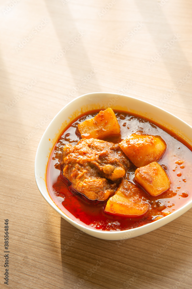 Thai Chicken massaman curry - Thai chicken and potato curry in coconut milk and herb eat with white rice Thai Chicken massaman curry - Thai chicken and potato curry in coconut milk and herb eat with white rice