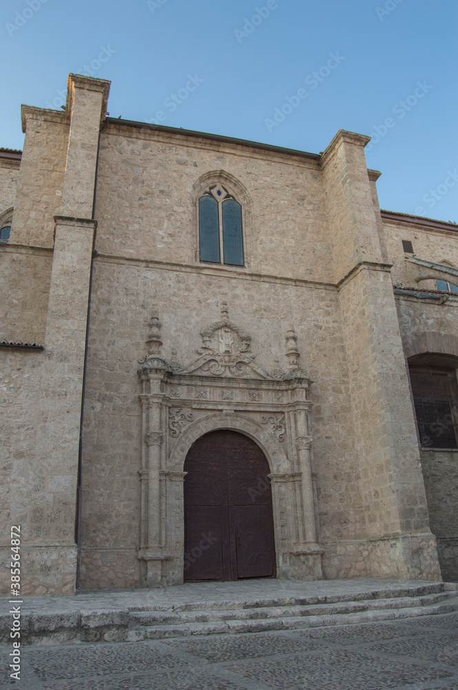 Gothic Renaissance church facade with door and window in Torrijos, Toledo province. Spain