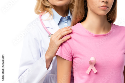 Cropped view of doctor hugging young woman with pink ribbon on t-shirt isolated on white