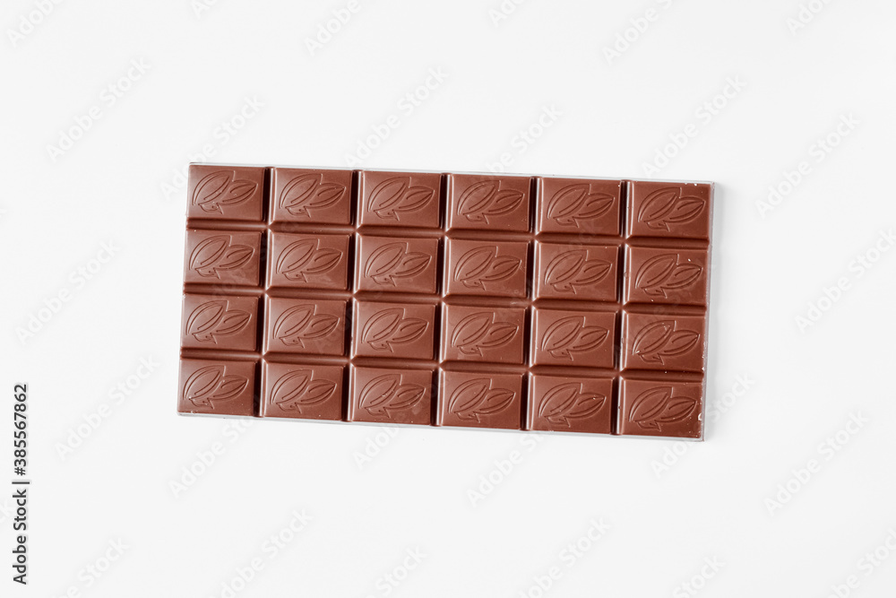 Milk chocolate bar isolated on white background