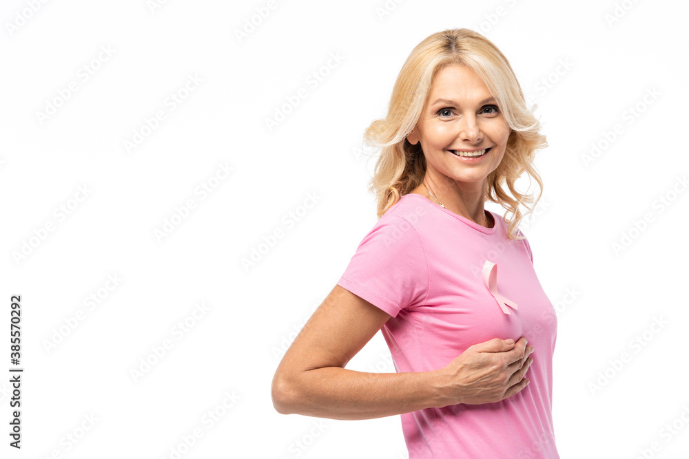 Blonde woman looking at camera while touching breast with cancer awareness isolated on white Blonde woman looking at camera while touching breast with cancer awareness isolated on white