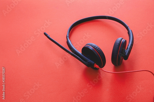 Headset on black background. Call center, home office, customer service support, help desk