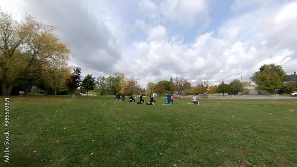 Fall Season Timelapse of people doing yoga in a park Fall Season Timelapse of people doing yoga in a park