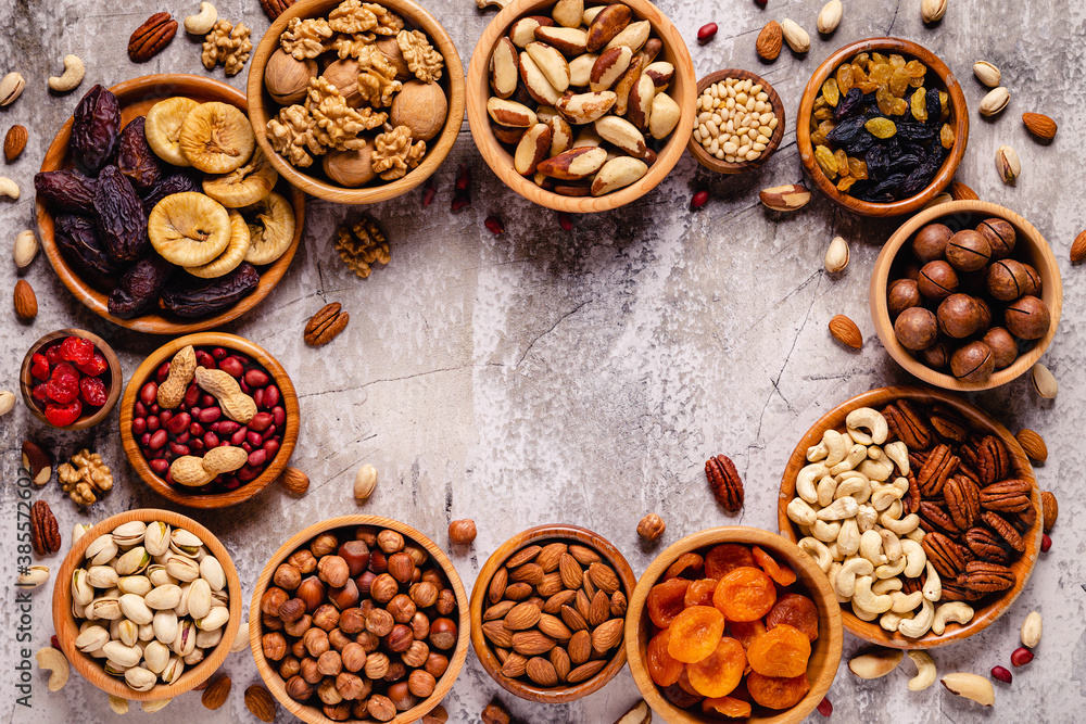 Various Nuts and dried fruits in wooden bowls. Various Nuts and dried fruits in wooden bowls.