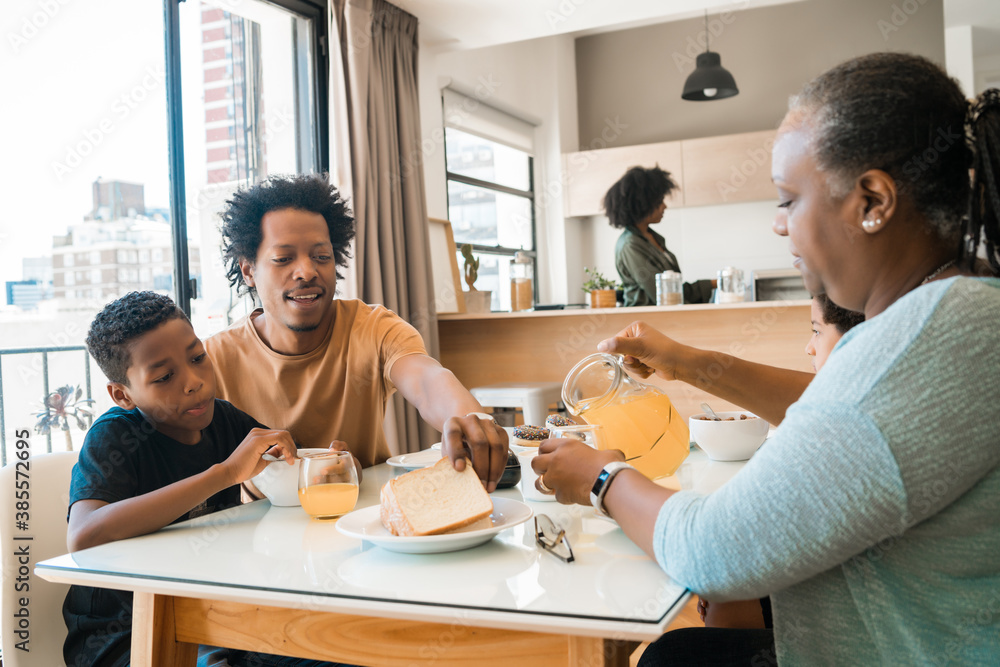Family having breakfast together at home. Family having breakfast together at home.