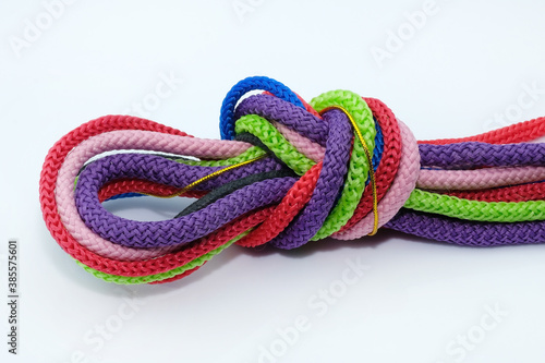 Colored shoe laces with polyester on a white background. round Polyester cord tied in a knot, serhu look. Drawstrings for adjusting hoods and belts in sportswear.