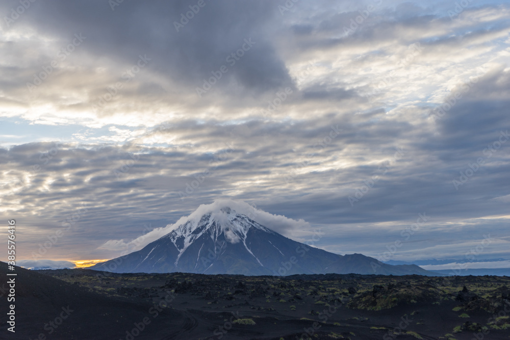 At sunrise, the cone of the Big Udina volcano