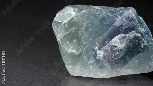 Mineral fluorite on a black background. A floating spar close-up of the view. photo