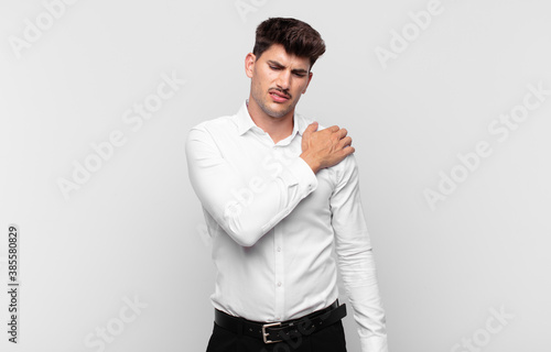 Foto young handsome man feeling tired, stressed, anxious, frustrated and depressed, s