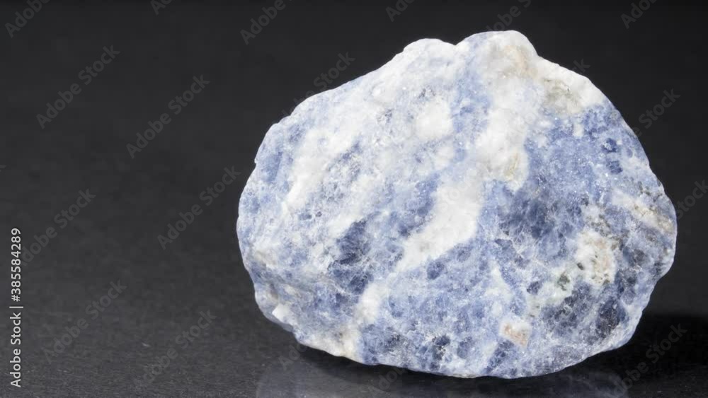 Mineral will be salted on a black background. Decorative and ornamental stone close-up . Mineral will be salted on a black background. Decorative and ornamental stone close-up .