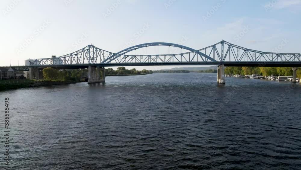 Aerial view of a metal bridge across the Mississippi river in La Crosse, Wisconsin. Low flying shot of a typical industrial bridge across the river. Aerial view of a metal bridge across the Mississippi river in La Crosse, Wisconsin. Low flying shot of a typical industrial bridge across the river.