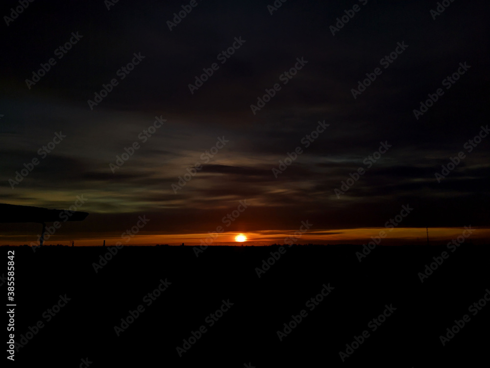 dawn over a small and calm city view from the roof of a multistory building