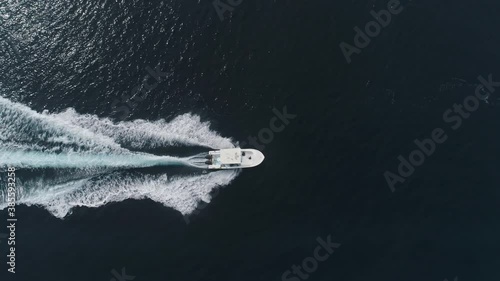 Wallpaper Mural Aerial View Over Fishing Boat On The Sea. Small ship floats on sea surface leaving a path of sea foam water. Cinematic Boat In Beatiful Costa Rica Sea. Torontodigital.ca