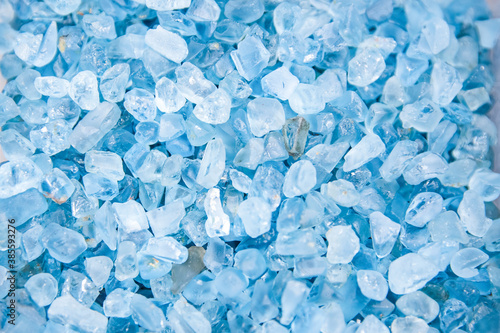 Photos Natural background of uncut blue topaz, large stones extracted from ore